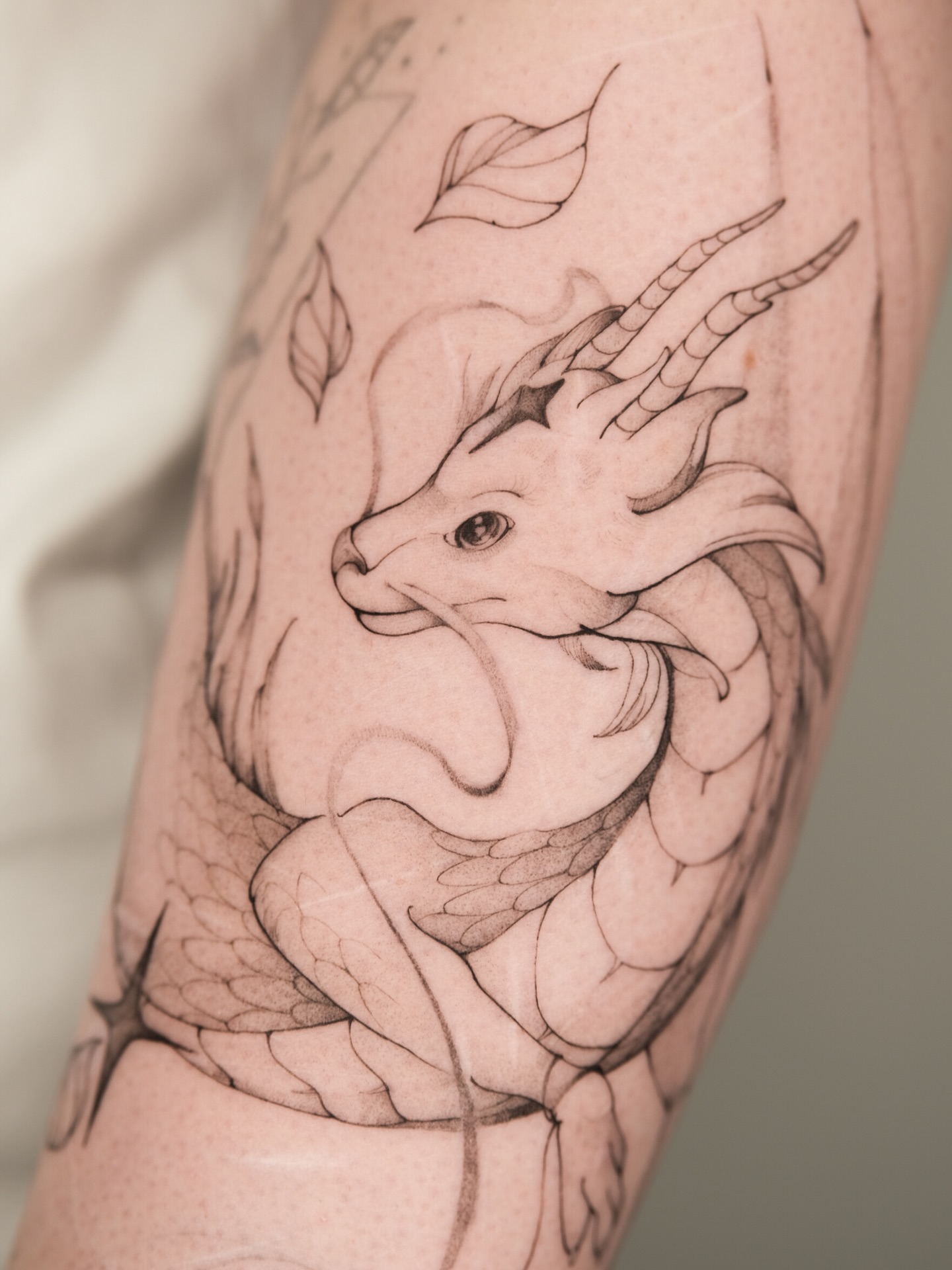 fine line dragon tattoo